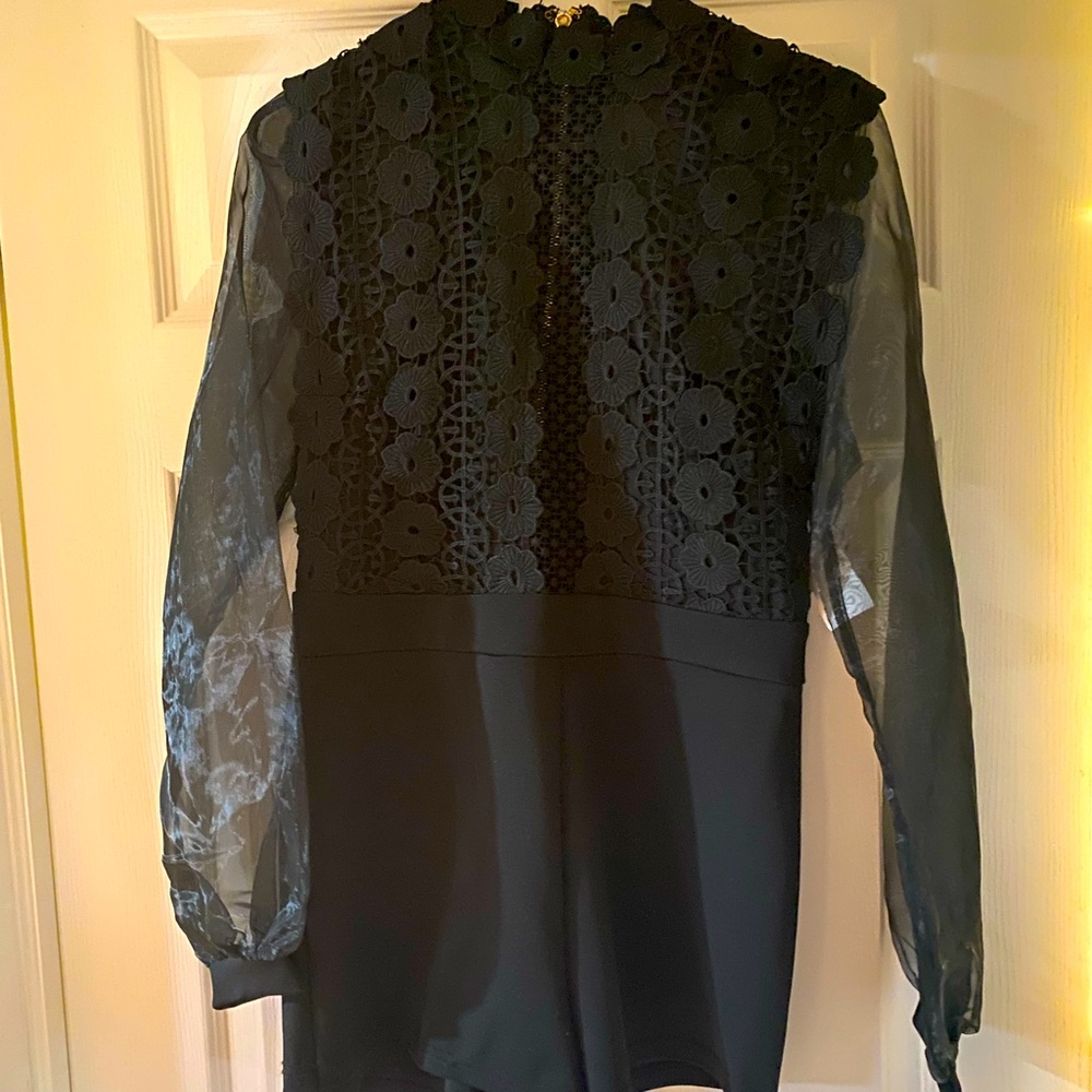 Elegant black laced romper.